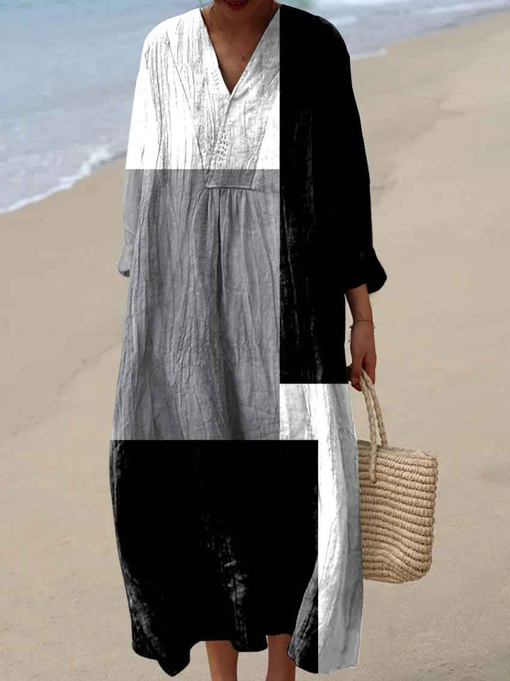 Stylish women's vibrant patchwork maxi dress with long sleeves & V-neck, a flowy, elegant statement piece for fashion.