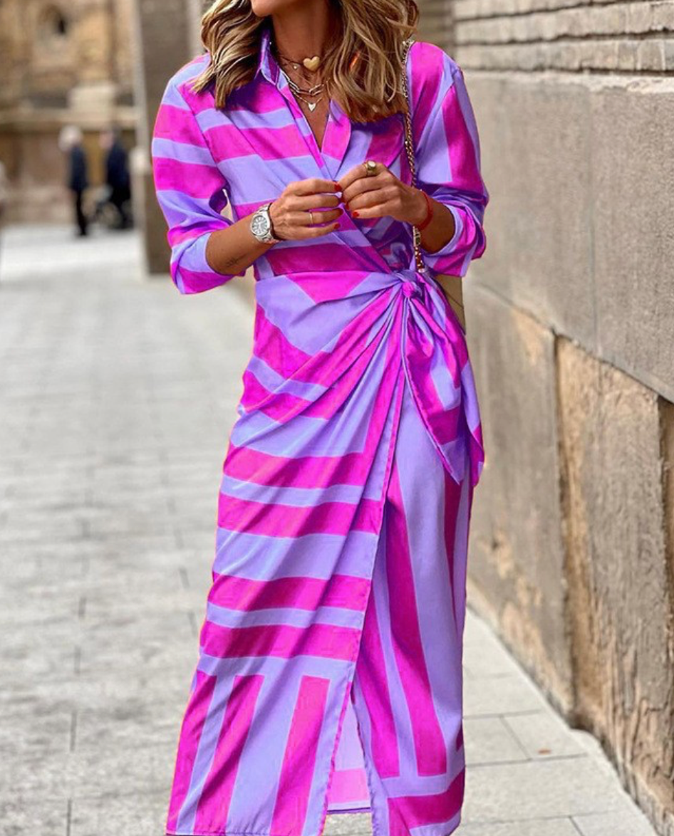 Printed women's wrap dress, vibrant and chic. Effortless style for summer and casual wear.