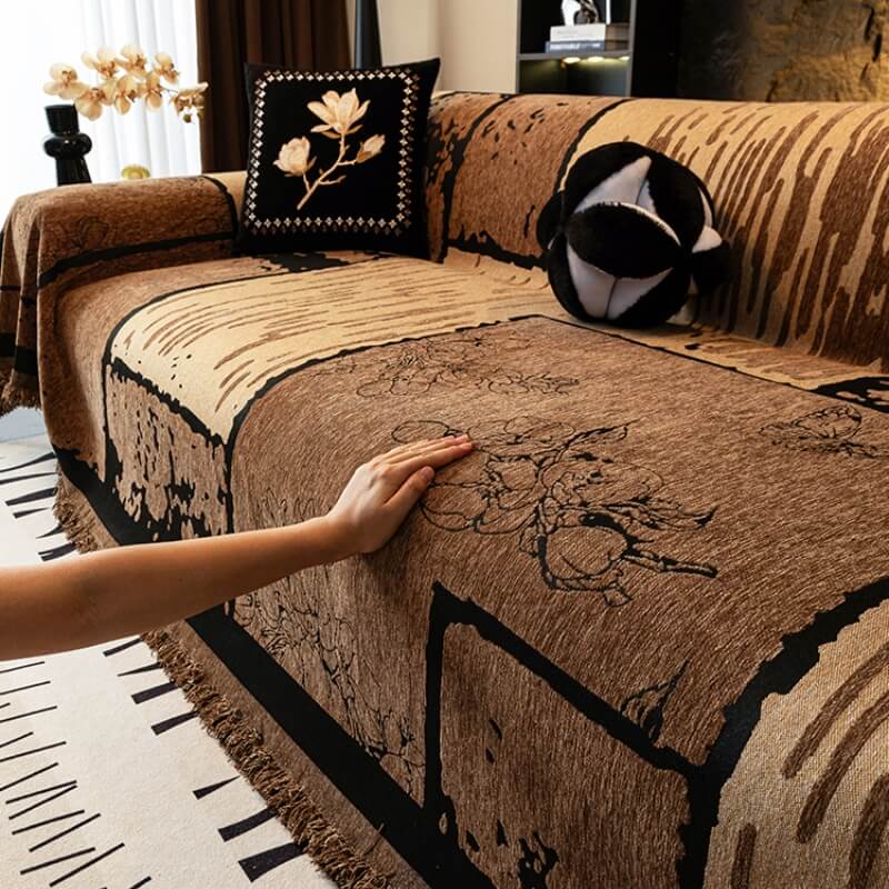 Overhead view of a sofa with a vintage chenille throw, illustrating full coverage and furniture protection