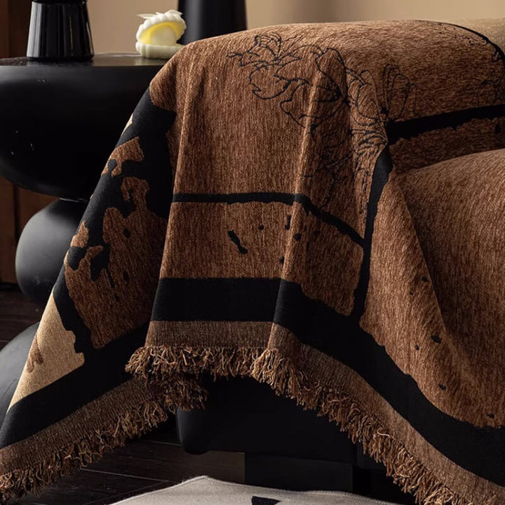 Textured vintage chenille throw blanket acting as a sofa protector, enhancing home decor with its design