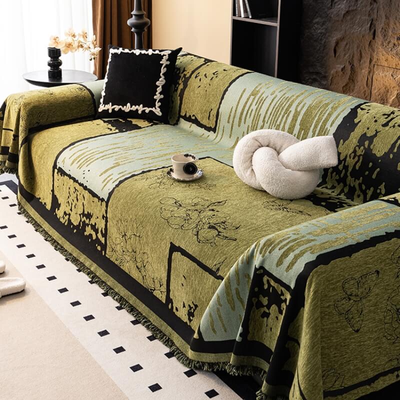 Stylized shot of a vintage chenille sofa protector throw on a modern couch, blending styles seamlessly
