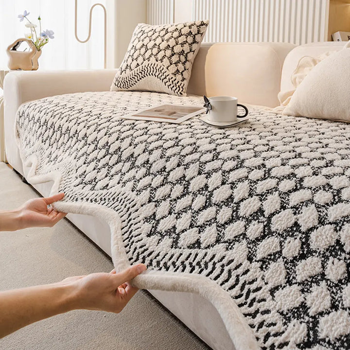 Machine washable vintage chenille couch cover protecting a sofa from pet scratches