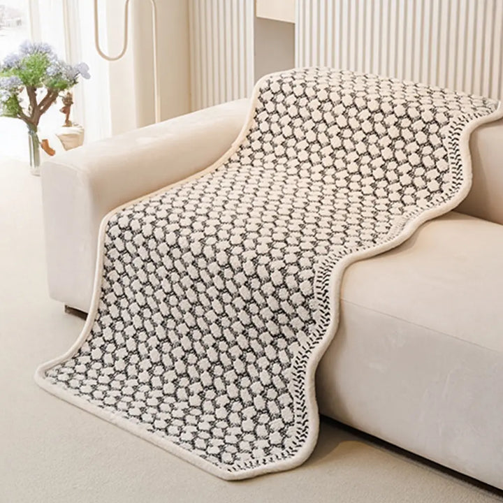 Vintage chenille scratch resistant couch cover draped over a sofa, enhancing home decor