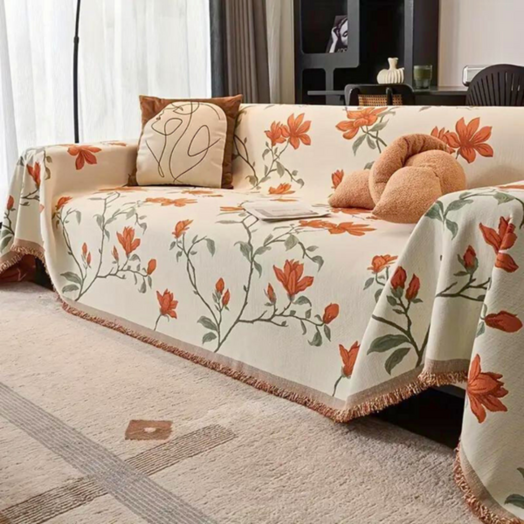 Chenille sofa cover with a vintage floral pattern and tassel detail, perfect for cozy living rooms.