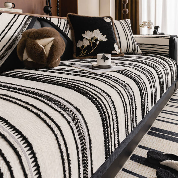 Full view of a living room with a vintage jacquard chenille non-slip couch cover on a sofa.