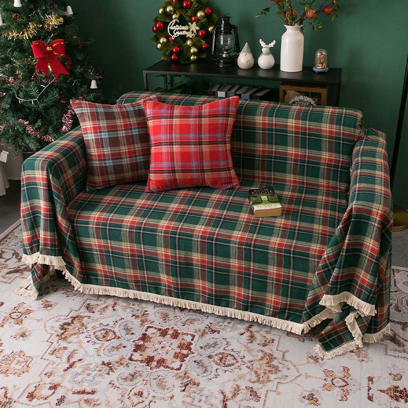 Vintage plaid sofa cover draped over a couch, perfect for festive Christmas home decor.