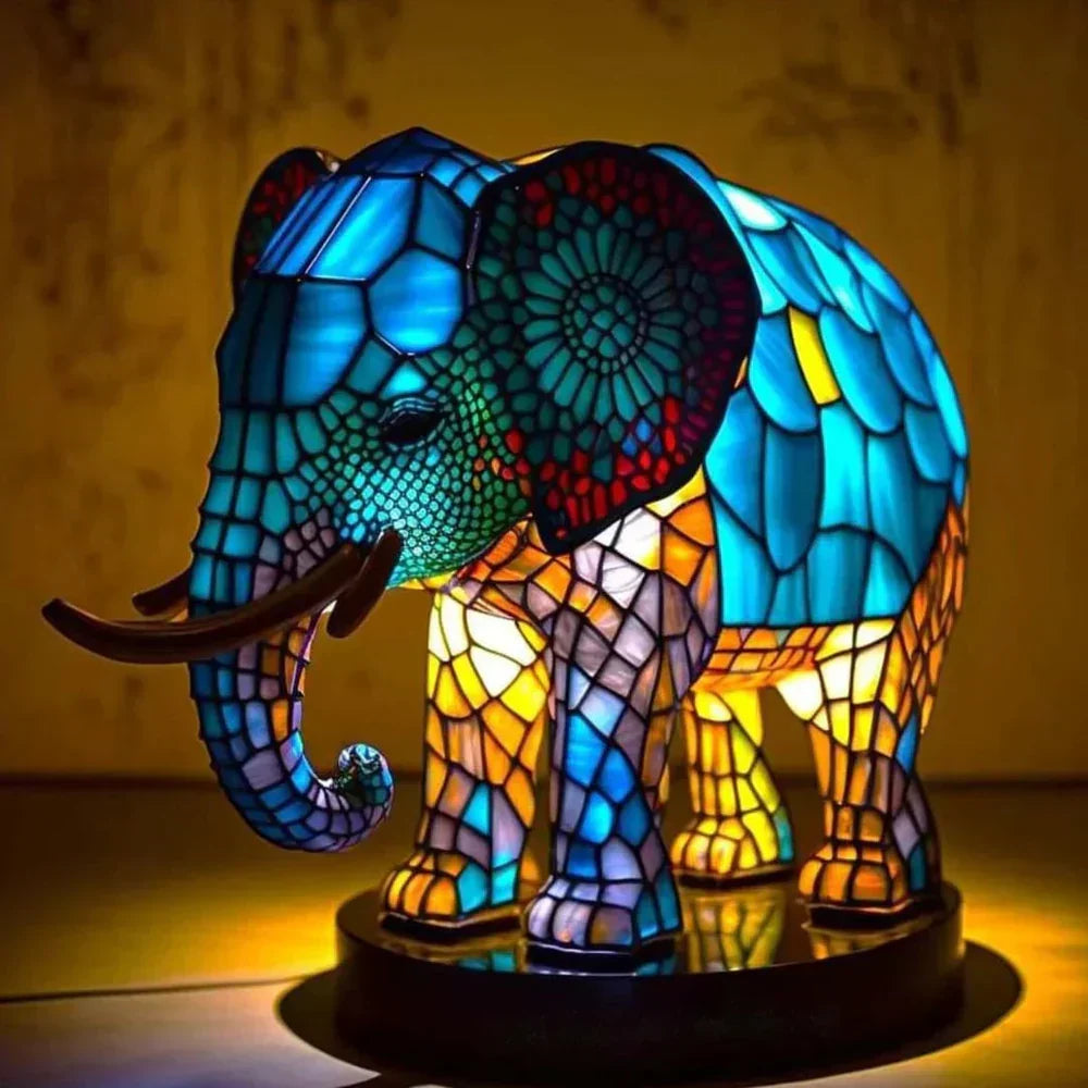 Ambient lion stained glass table lamp. Artistic wildlife lighting, animal decor & unique home accent.