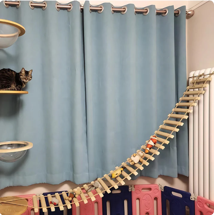 Wall-mounted cat climbing bridge with sisal ladder for active play and enrichment.