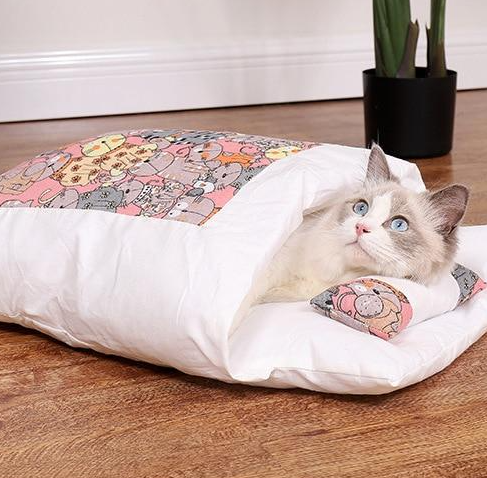 Close-up of the fabric texture of a washable cat sleeping bag pet bed, highlighting softness