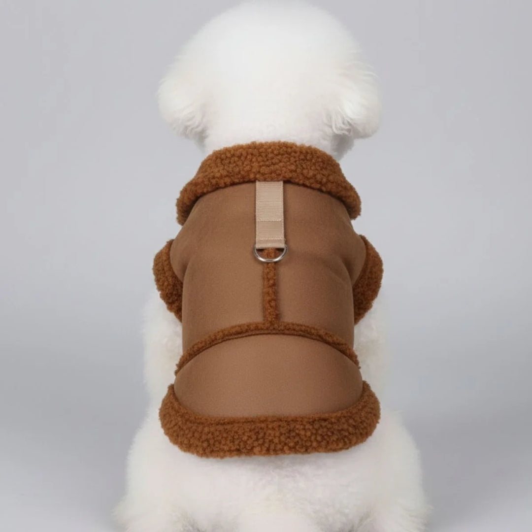 Close-up of a cozy dog winter coat featuring a soft shearling lining and durable harness attachment.