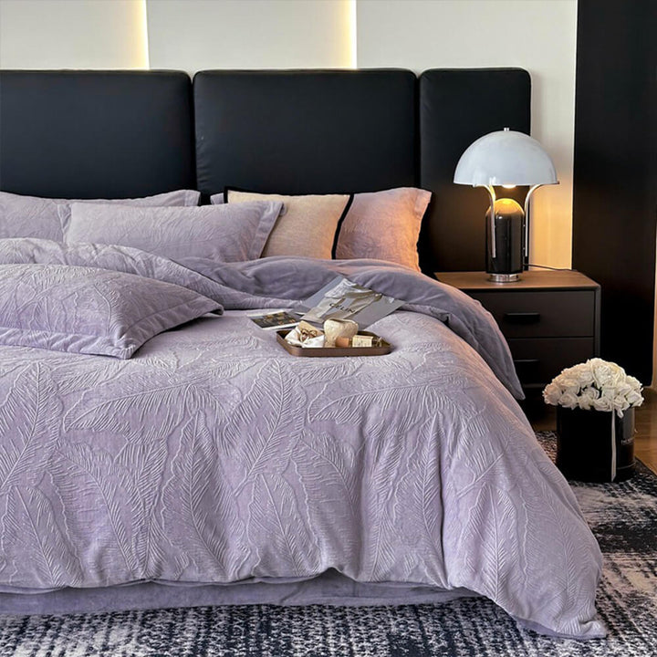 Cozy bedroom essential: embossed velvet sheet set with a charming leaf pattern.