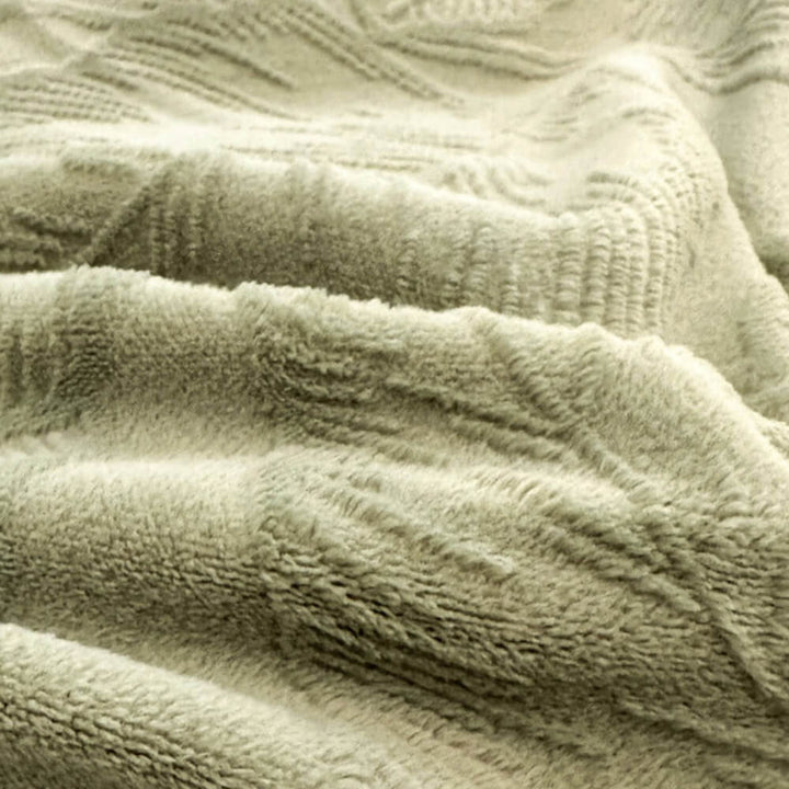 Soft embossed velvet sheet set in a natural leaf pattern, adding luxury to bedroom decor.