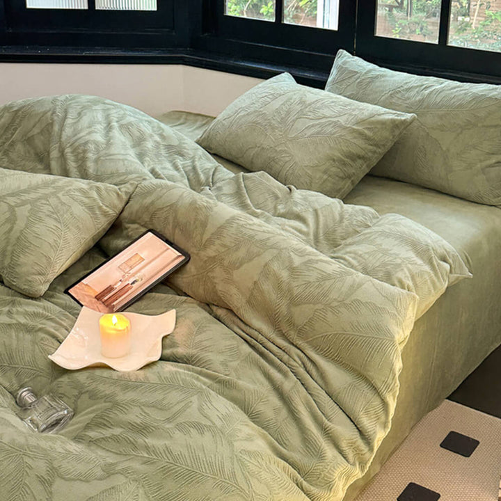 Cozy warm bedding: embossed milk velvet sheet set with intricate leaf designs.