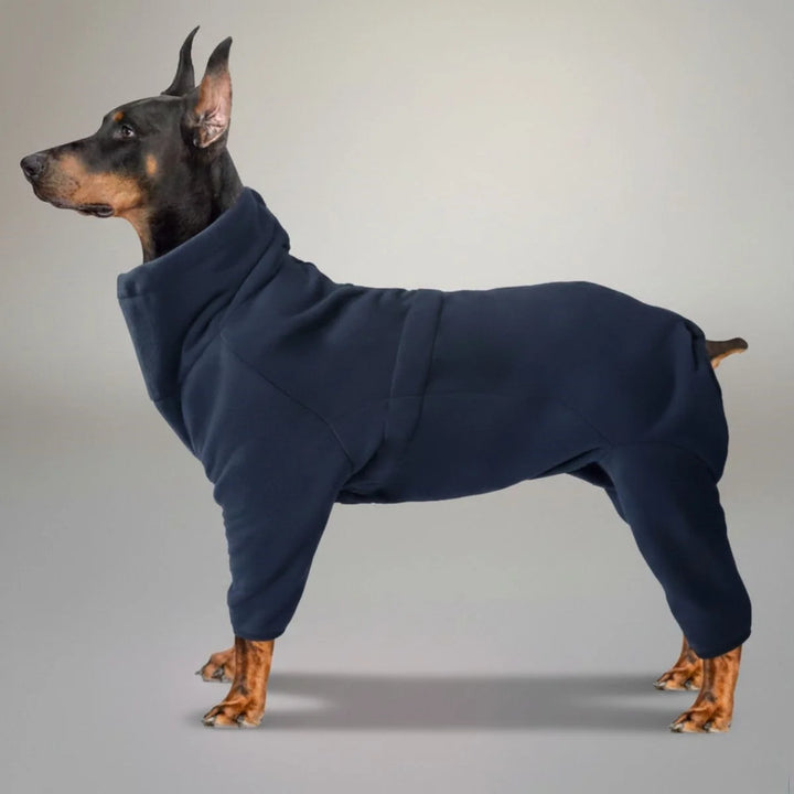 Cozy red fleece dog jumpsuit, full body pet apparel, designed for warmth during winter walks and outdoor play.