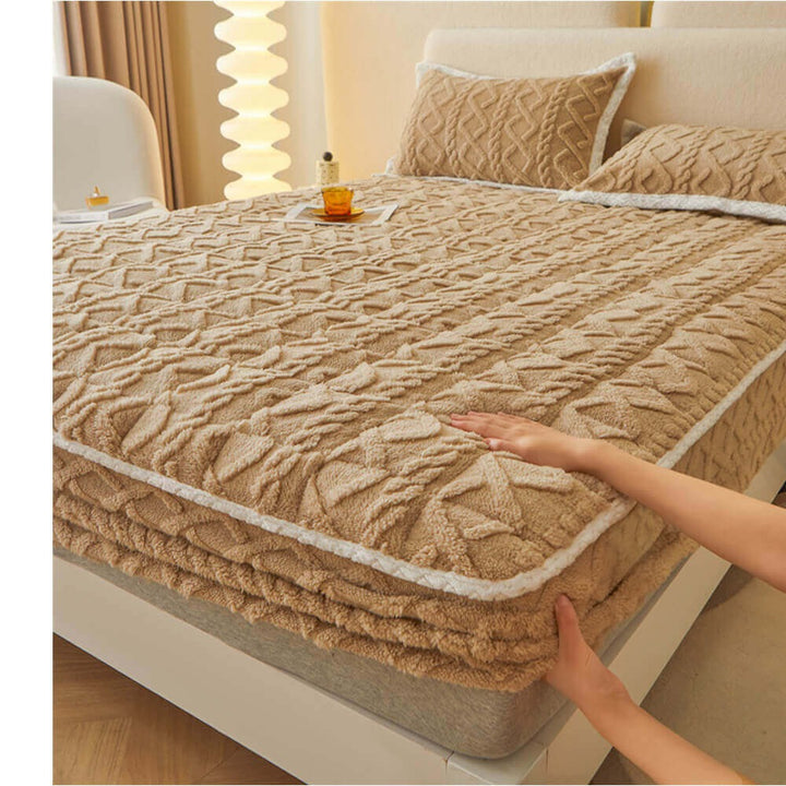 Washable anti-static quilted mattress cover in a neutral color, providing a soft fluffy texture.