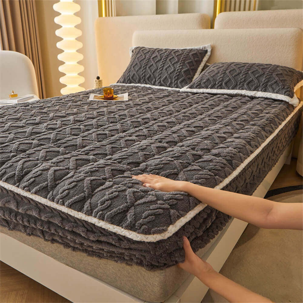 Bedroom decor featuring a warm and fluffy washable mattress cover, enhancing winter comfort.