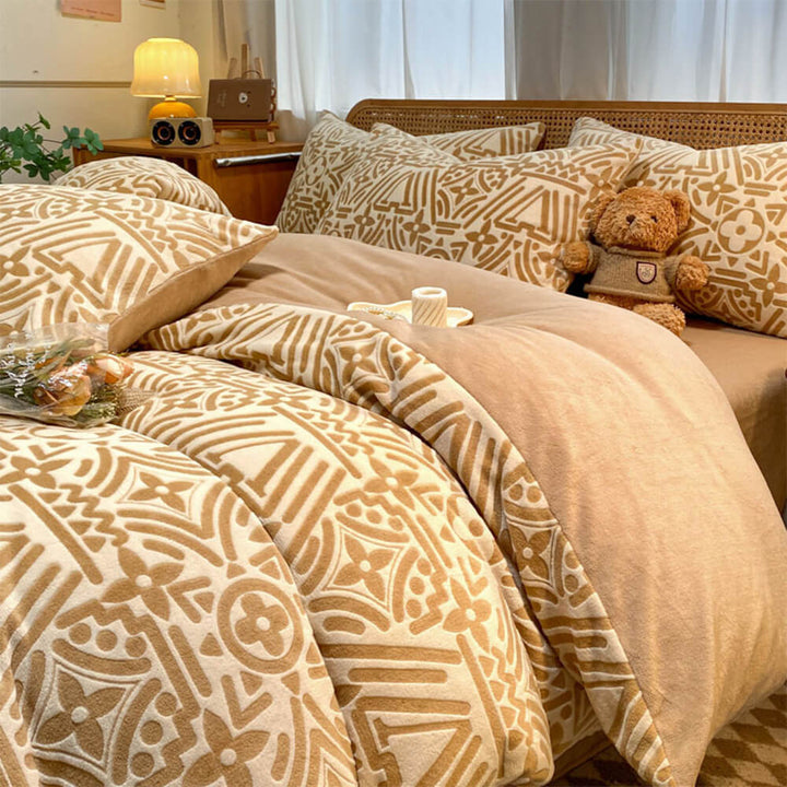 Warm geometric milk velvet bed sheet set, soft anti-static bedding for comfort and bedroom decor.