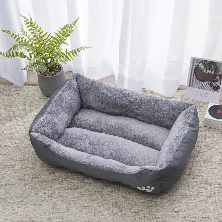 Comfortable unisex pet bed, waterproof bolster design, providing warmth and support for winter.