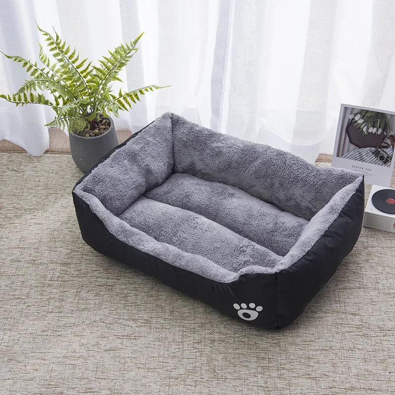 Plush waterproof bolster pet bed with soft, high walls, ensuring cozy winter comfort for dogs.