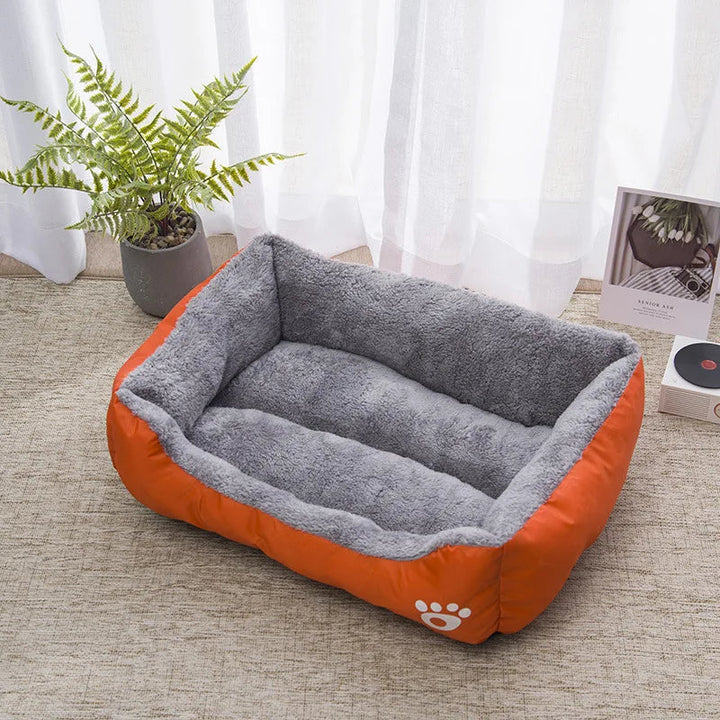 Easy-clean waterproof pet bed, bolster style, offering durable warmth and comfort for pets this winter.