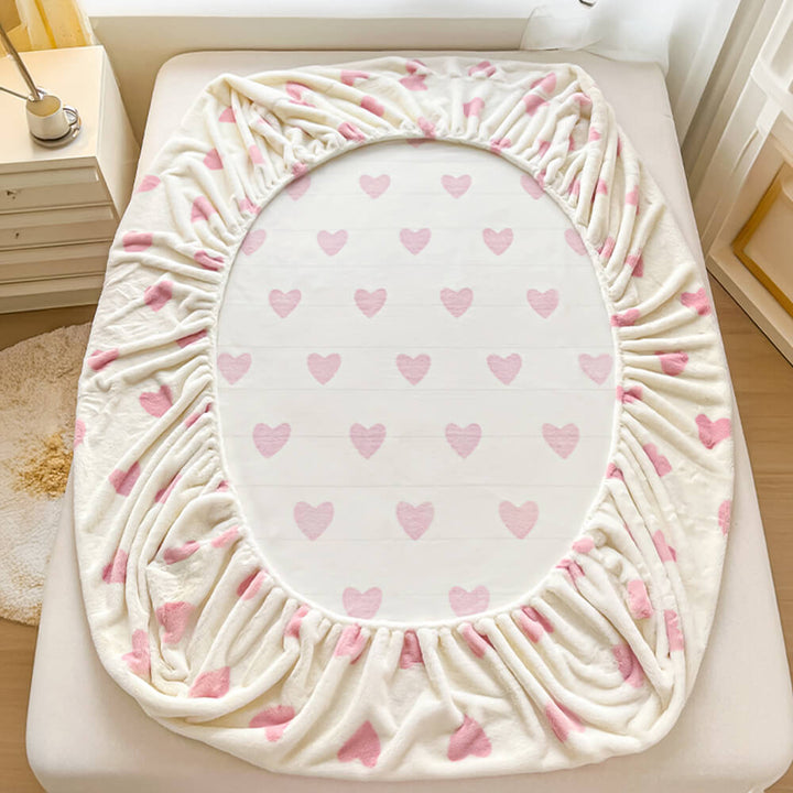 Soft milk velvet fitted sheet and matching pillowcases set, anti-static bedding for comfort.