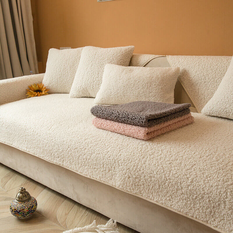 Beige teddy fleece non-slip sofa cover in an elegant living room, ultimate comfort.
