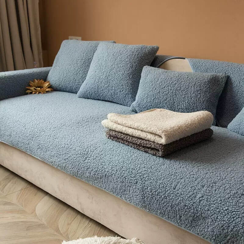 Close-up of fluffy teddy fleece texture on a non-slip couch cover, soft and warm.