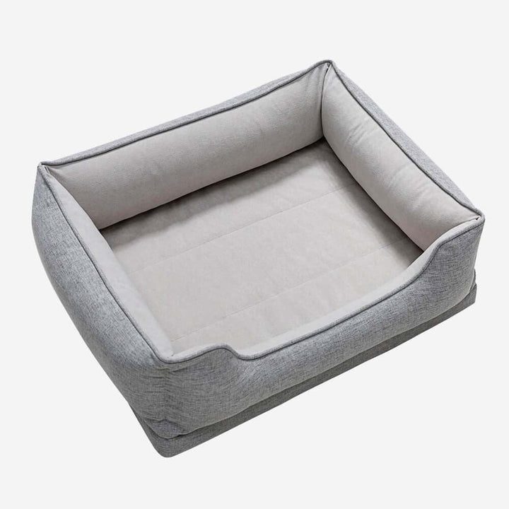 Durable non-slip base of a washable bolster pet bed for cats, ensuring pet safety
