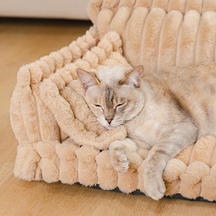 Plush washable cat bed with a high bolster for superior neck and joint comfort