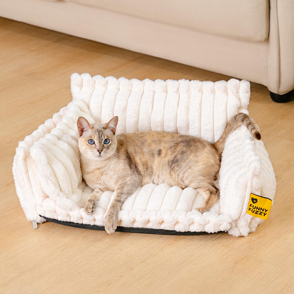 Top-down view of the deep, cozy interior of a washable bolster cat bed