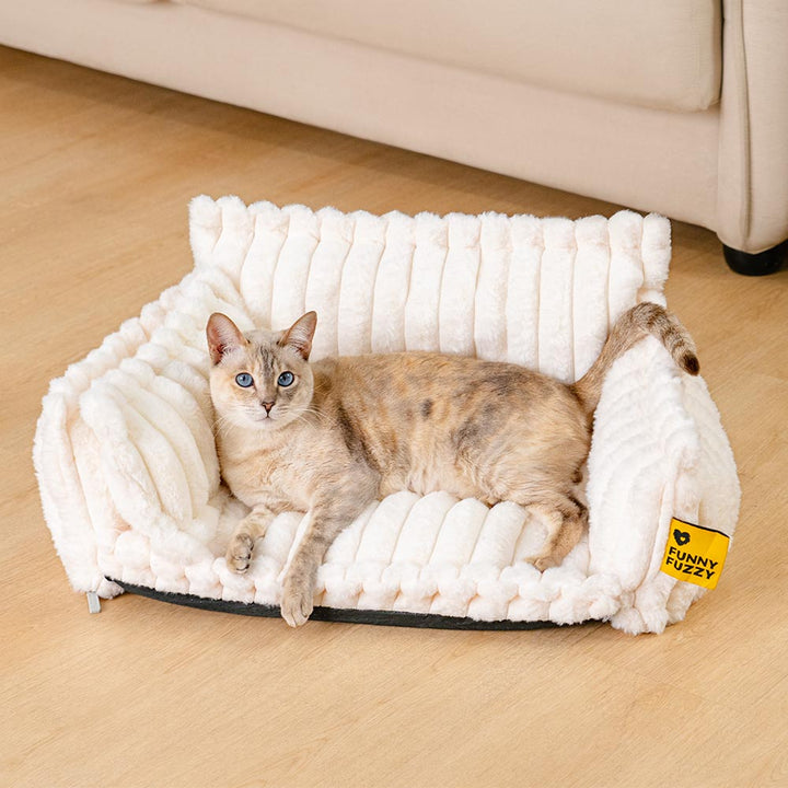 Top-down view of the deep, cozy interior of a washable bolster cat bed