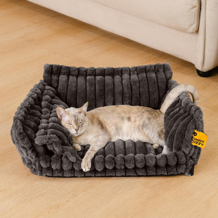 Cozy pet bed with raised bolster for head support, ideal for cat joint comfort