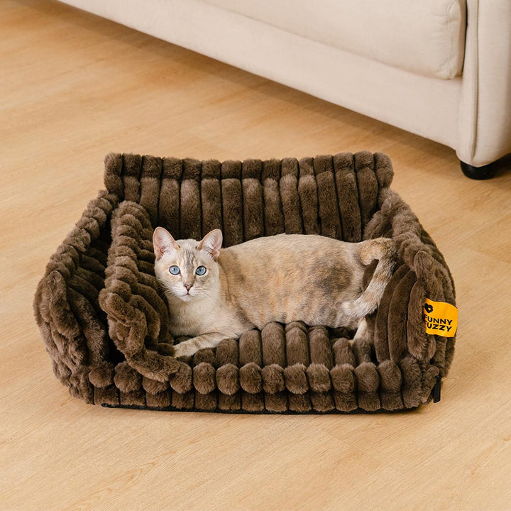 Front view of a calming cat bed with bolster, promoting joint support and comfort