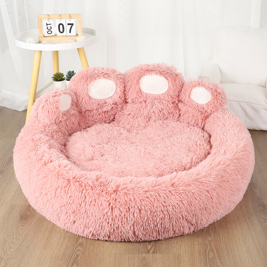 Soft, cozy donut-shaped pet kennel in a neutral tone, designed for small/medium pets, easy to clean.