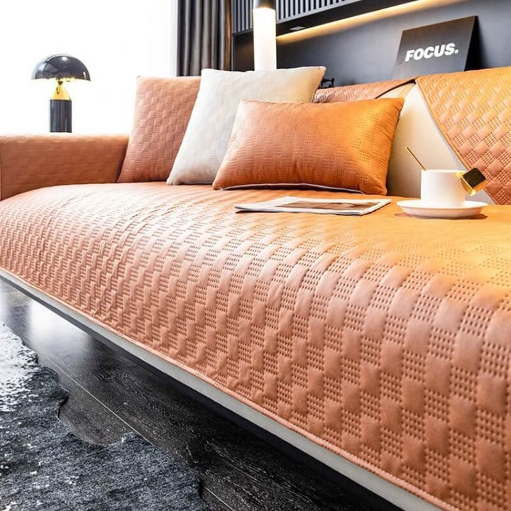 Machine washable faux leather furniture protector in vibrant green, bringing color and practicality to living spaces.