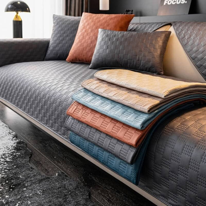 Sectional faux leather sofa cover in brown, offering a stylish and pet-friendly furniture protector for living rooms.