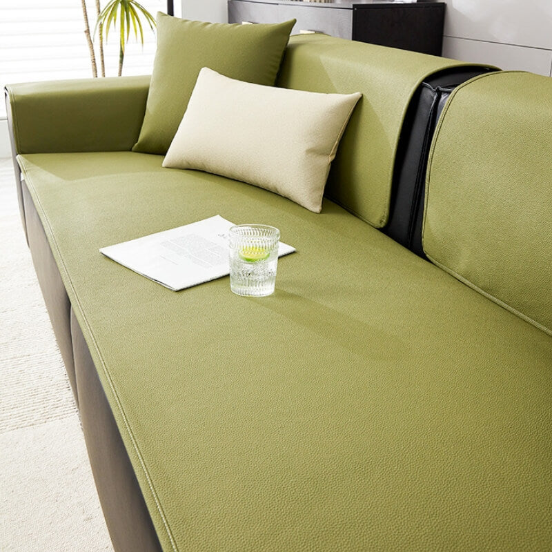 The durable, easy-clean technical fabric of the water-resistant sofa protector for pet supplies.