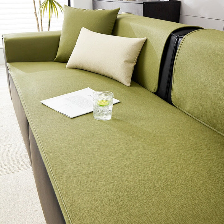 The durable, easy-clean technical fabric of the water-resistant sofa protector for pet supplies.