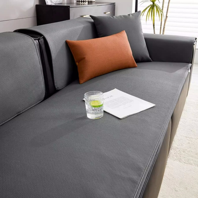 Close-up of the technical fabric of the waterproof sofa protector, showing its texture.