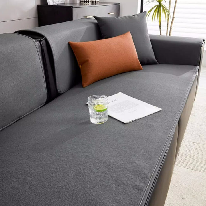 Close-up of the technical fabric of the waterproof sofa protector, showing its texture.