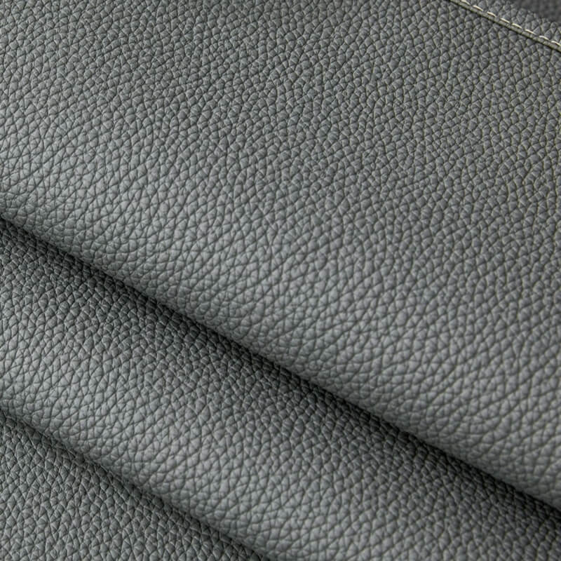 A dog comfortably napping on the pet-friendly couch cover, highlighting its durability.