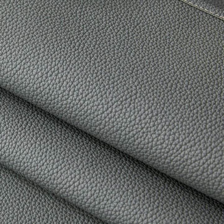 A dog comfortably napping on the pet-friendly couch cover, highlighting its durability.