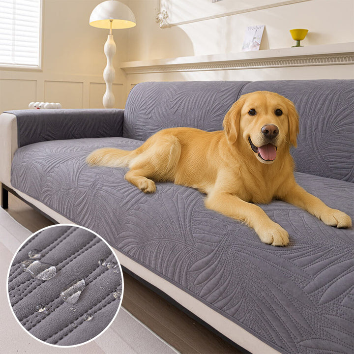 Water-resistant quilted sofa cover with non-slip backing, protecting furniture from spills and pet fur