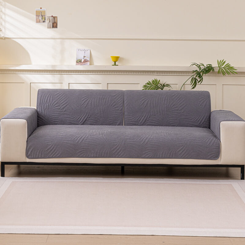 High-quality water-resistant sofa cover featuring a non-slip backing for effective furniture protection