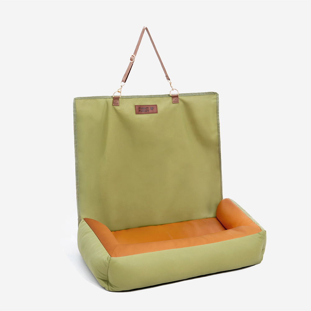 Portable waterproof anti-slip dog car seat cover folded for storage, pet travel convenience.