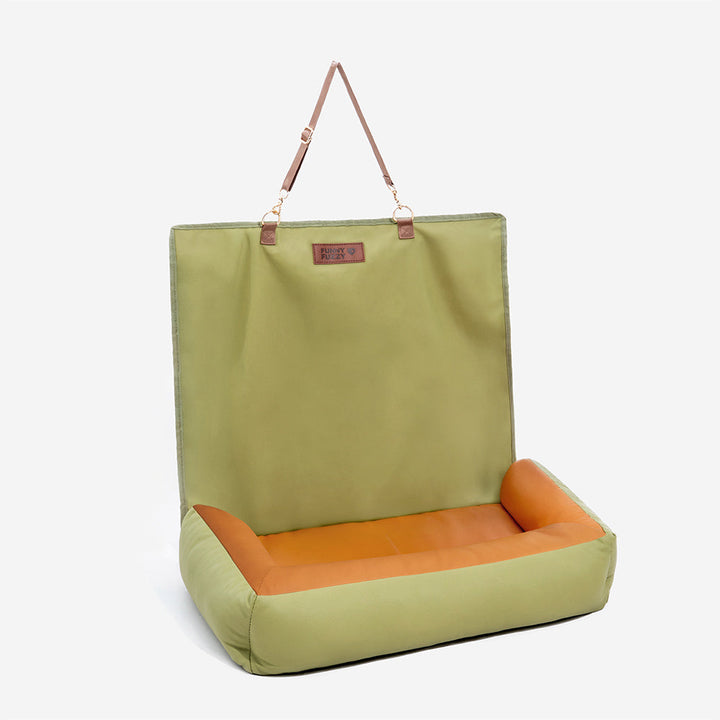 Portable waterproof anti-slip dog car seat cover folded for storage, pet travel convenience.