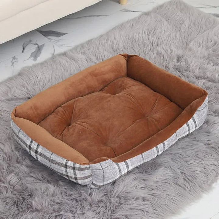 Dog's paw resting on the soft, comfortable edge of a waterproof pet bolster bed