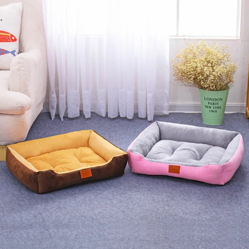 Dog sleeping soundly on a comfortable grey waterproof bolster pet bed