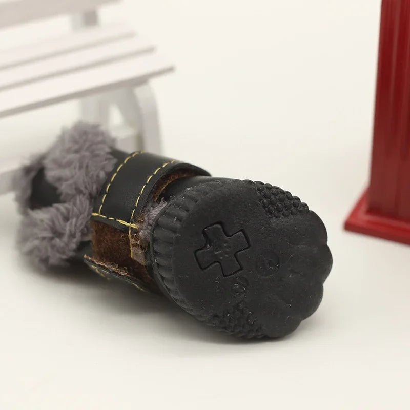 Set of four waterproof dog boots with cozy fleece insulation, ideal for winter outdoor activities.