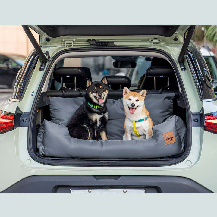 Medium dog comfortably nestled in a waterproof car seat bolster bed, travel safety